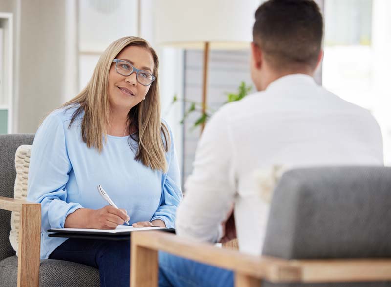 therapist working with a client