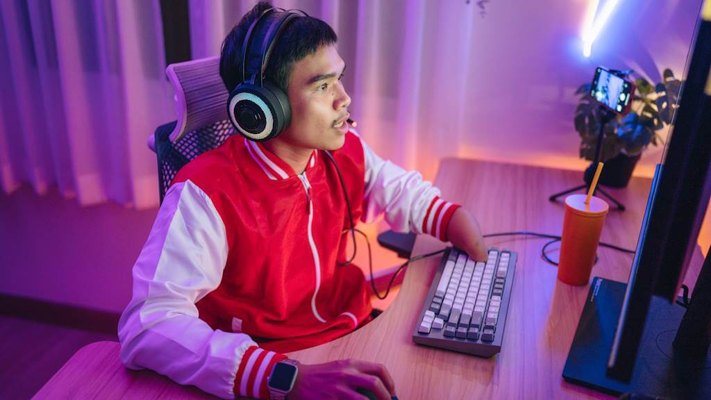 Male gamer intensely playing online games, illustrating gaming addiction for a behavioral health disorders 